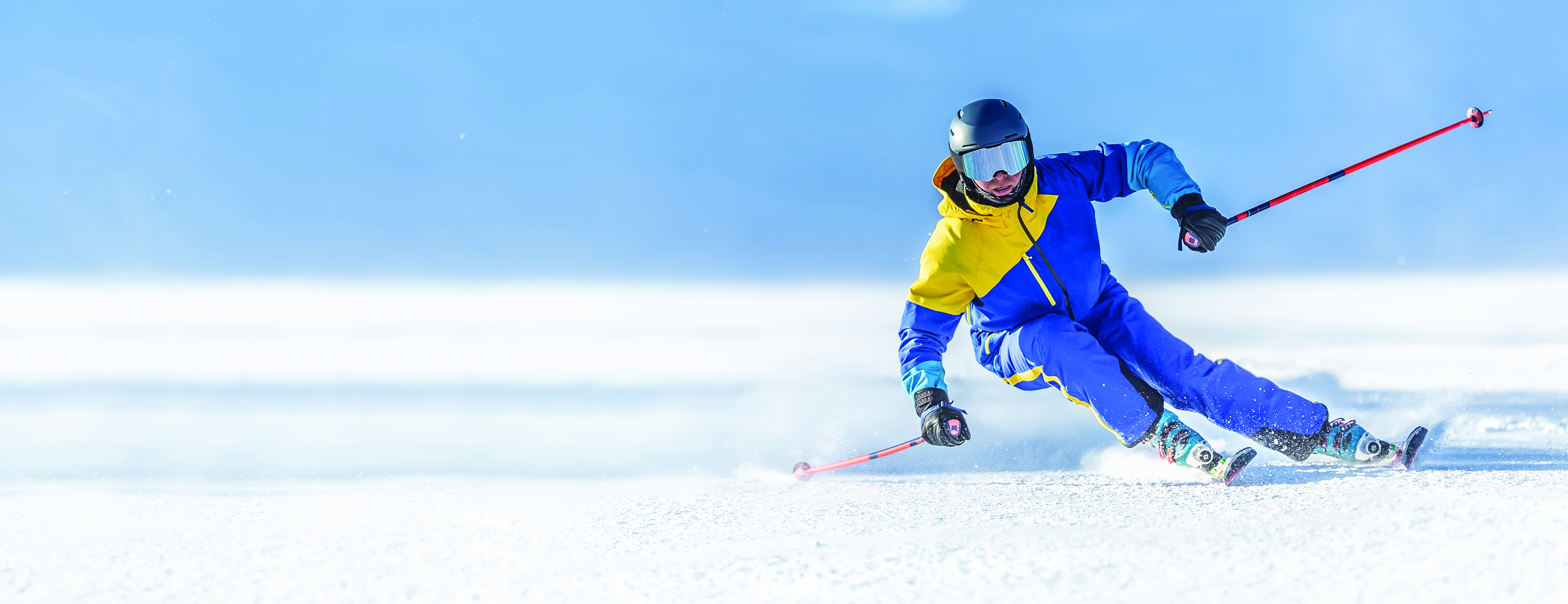 A downhill skier in a turn