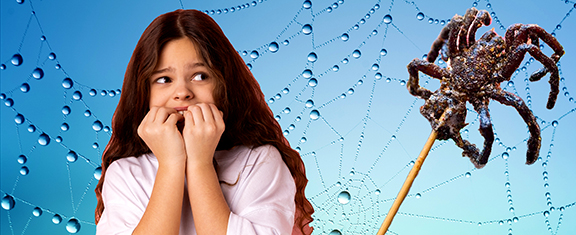 Girl looking at fried spider