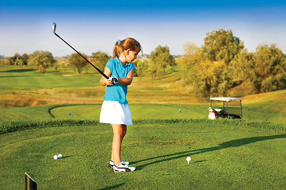 Girl golfing