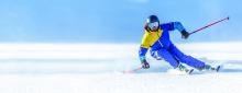 A downhill skier in a turn