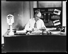 Carl Magee at his desk